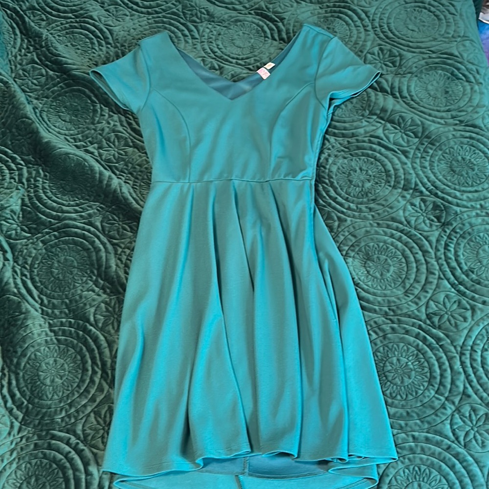 Dark teal fit and flare dress with cut out back